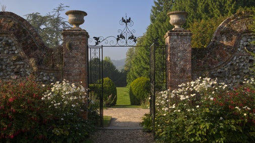 View through the garden gates at Polesden Lacey in autumn